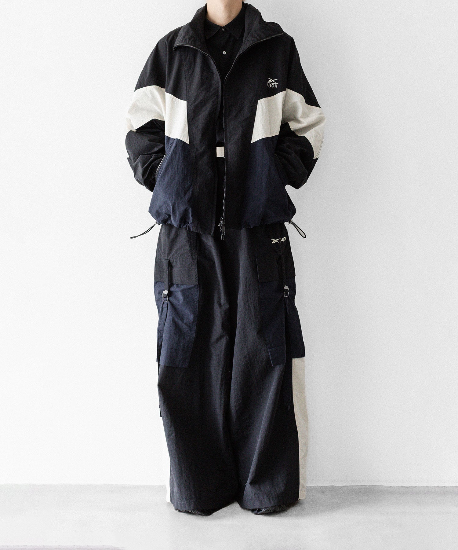 UJOH×Reebok】ZIP STAND COLLAR BLOUSON - BLACK | 公式通販サイト