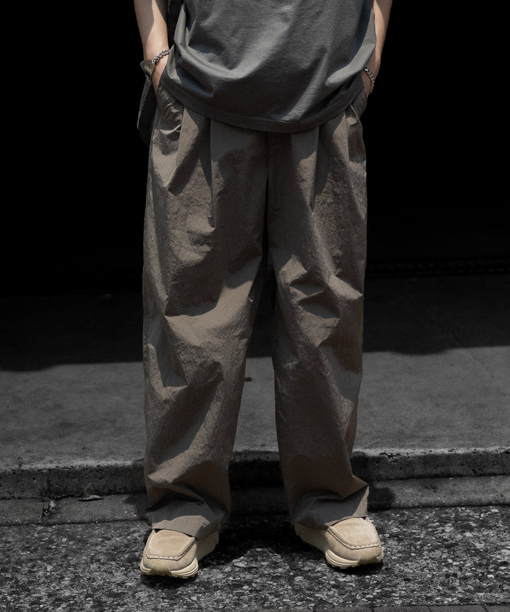 【ssstein】 WINDPROOF NYLON WIDE EASY TROUSERS - TAUPE
