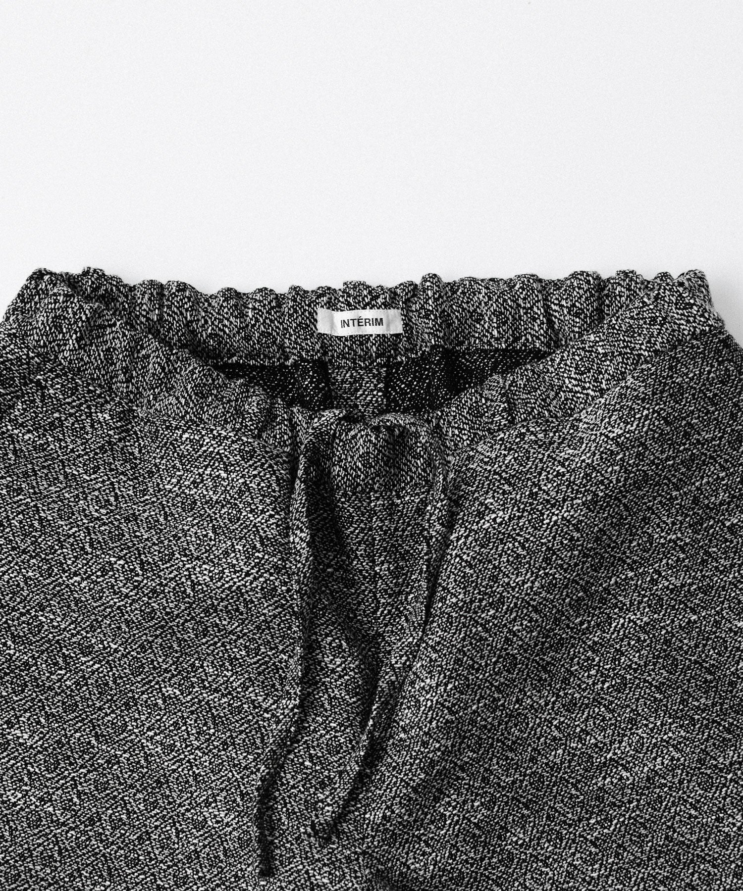 INTÉRIM - インテリムのDOUBLE SIDED JACQUARD TWEED DEAD STOCK WIDE DRESS EASY PANTSのBLACK